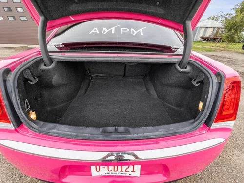 image of 10 passenger pink Chrysler limousine trunk