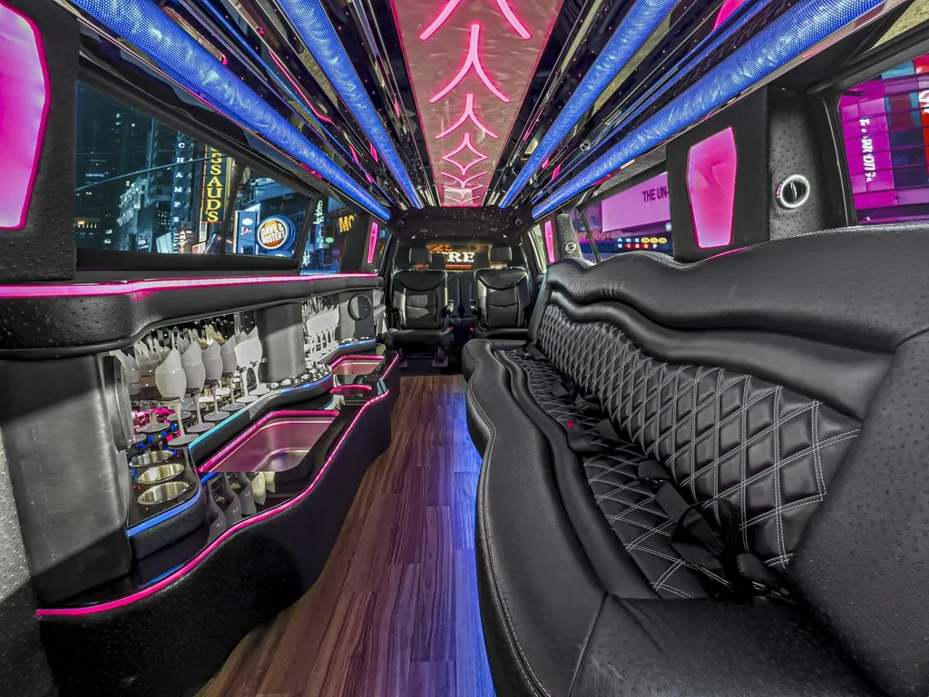 image of 14 passenger Cadillac XT6 limousinelit interior from rear passenger side captain chair 